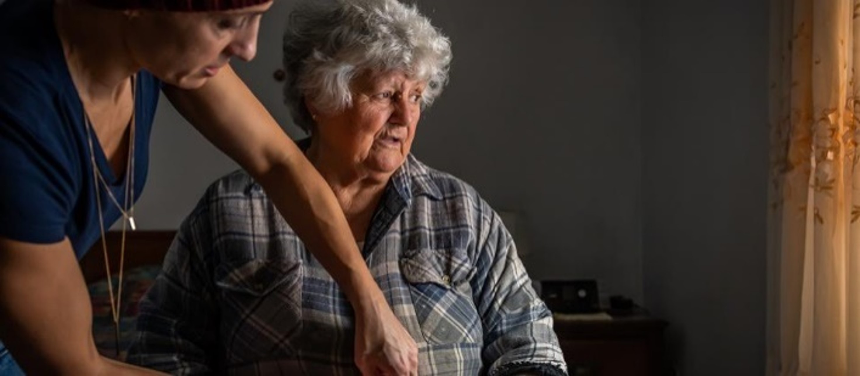 elderly patient with home support worker in a living room