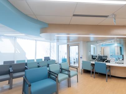 blue chairs in the reception area of a medical clinic