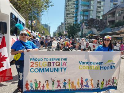 VCH Staff with a banner participating in the 2024 Vancouver Pride Parade